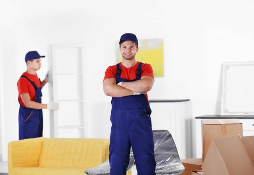 Local movers carrying boxes for a Dulwich small removal