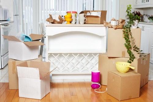 Family packing furniture for secure storage during home renovation